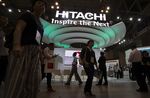 Visitors pass the Hitachi Ltd. booth at the Combined Exhibition of Advanced Technologies (CEATEC) in Chiba, Japan, on Tuesday, Oct. 4, 2016.