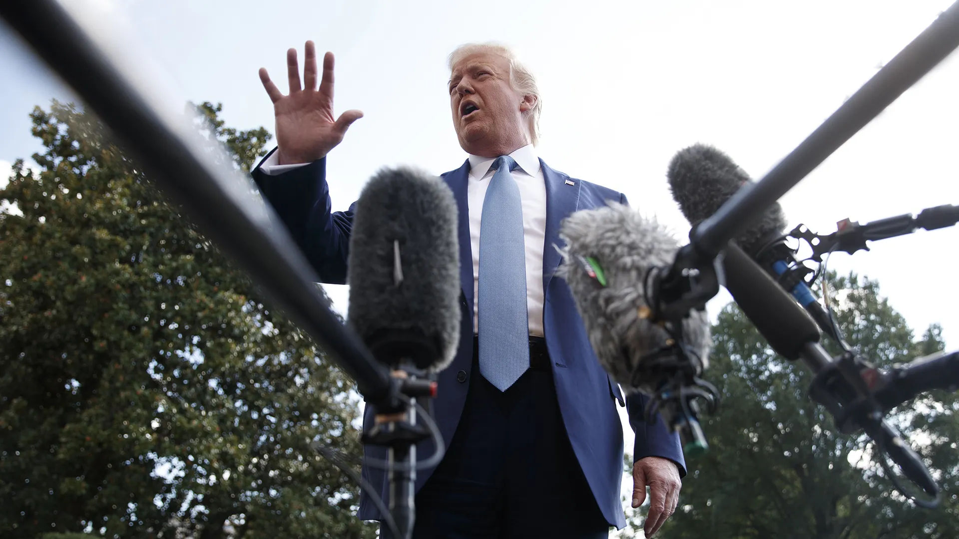 Donald Trump speaks to journalists outside the WHite House on Oct. 4.