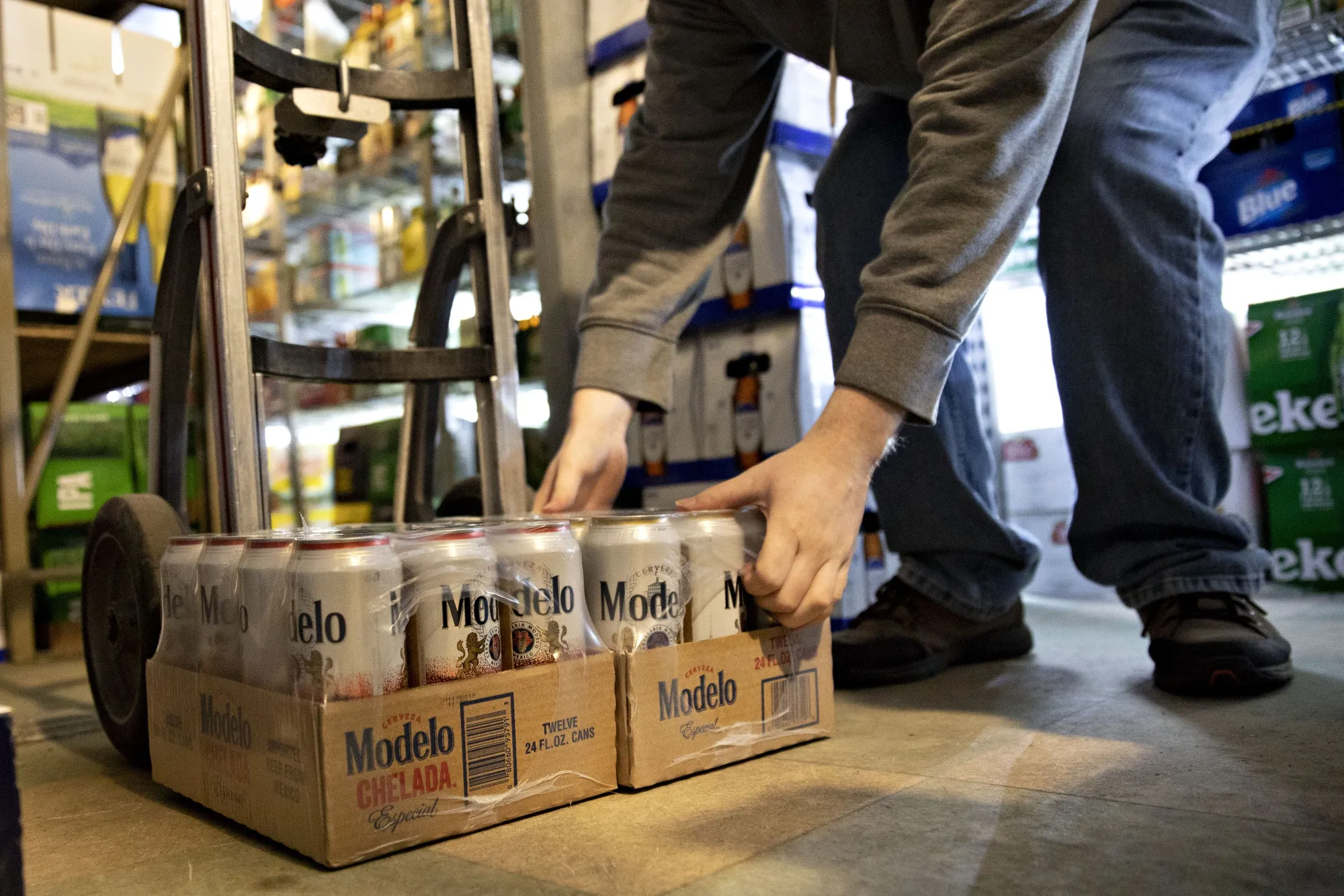 A driver picks up a package of Constellation Brands Inc. Modelo beer during a delivery in Ottawa, Illinois.