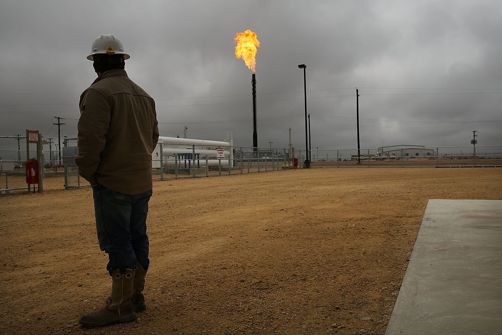 Flared natural gas is burned off at a natural gas plant in the Permian Basin in Garden City, Texas.&nbsp;