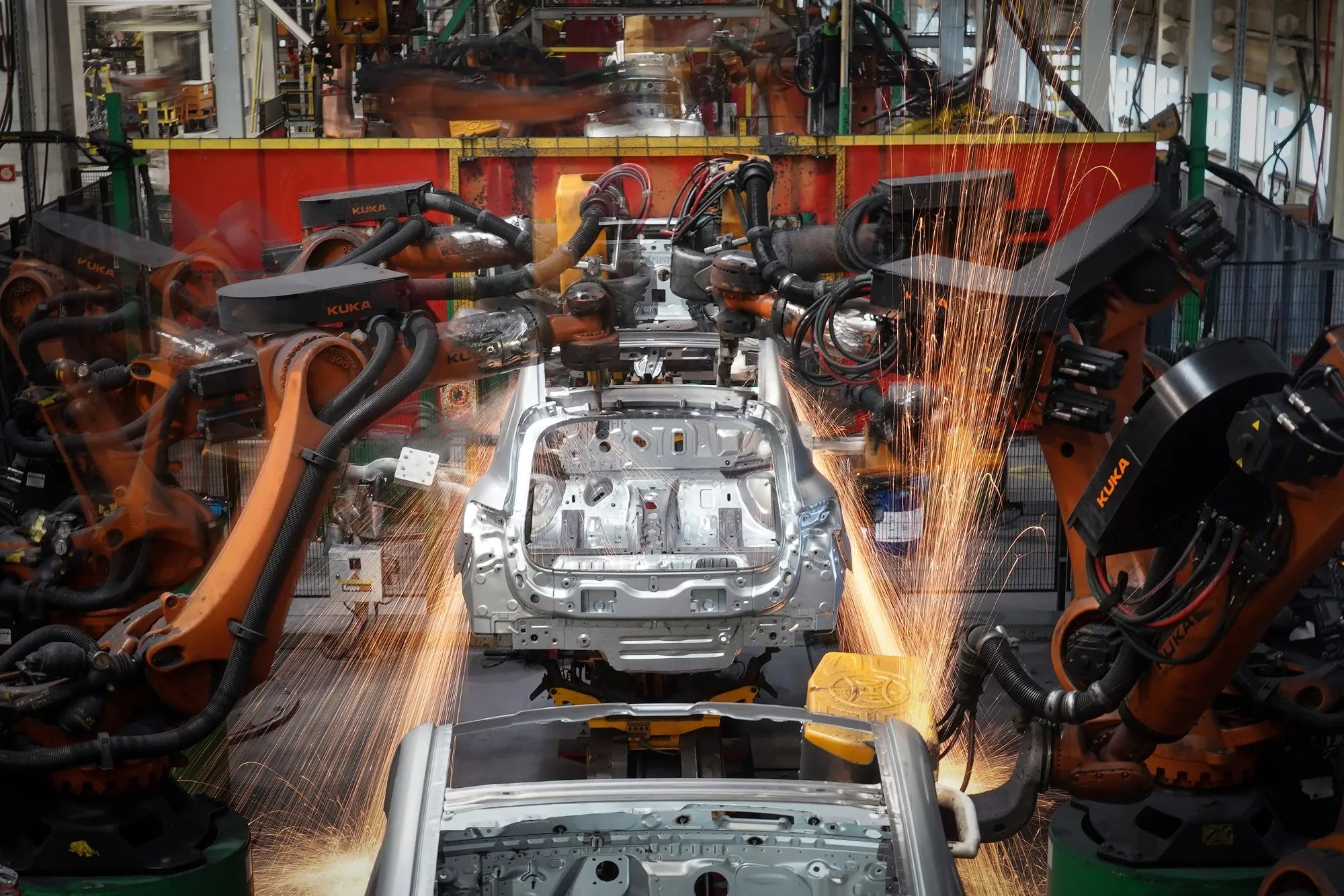 Robotic arms work on Renault Twingo automobiles on the production line at the Renault plant in Novo Mesto, Slovenia.