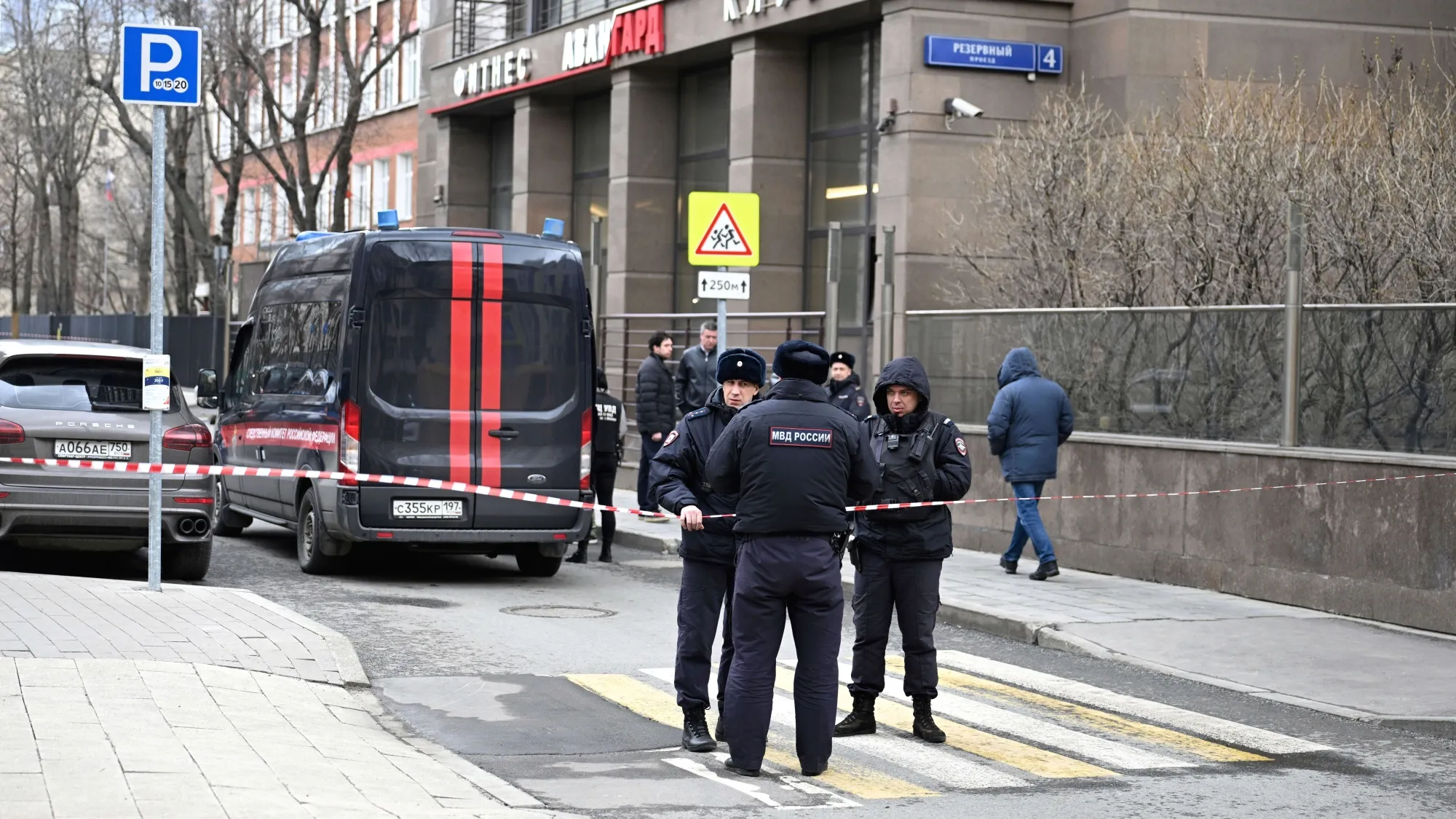 Russian police officers guard an area after a downed Ukrainian drone damaged a building in Moscow, Russia, on March 14.