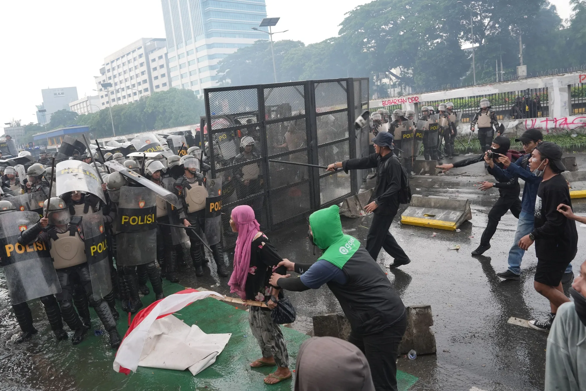 Demonstrators clash with police during a protest outside the parliament building in Jakarta on Aug. 28.