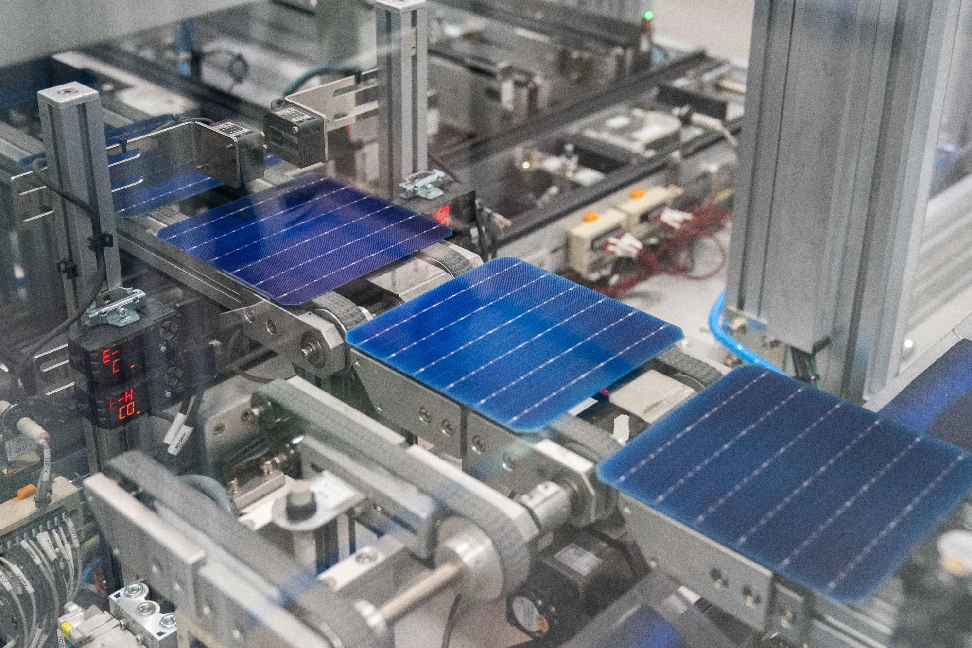 A machine etches solar cells at a solar cell and module manufacturing facility in Dalton, Georgia.