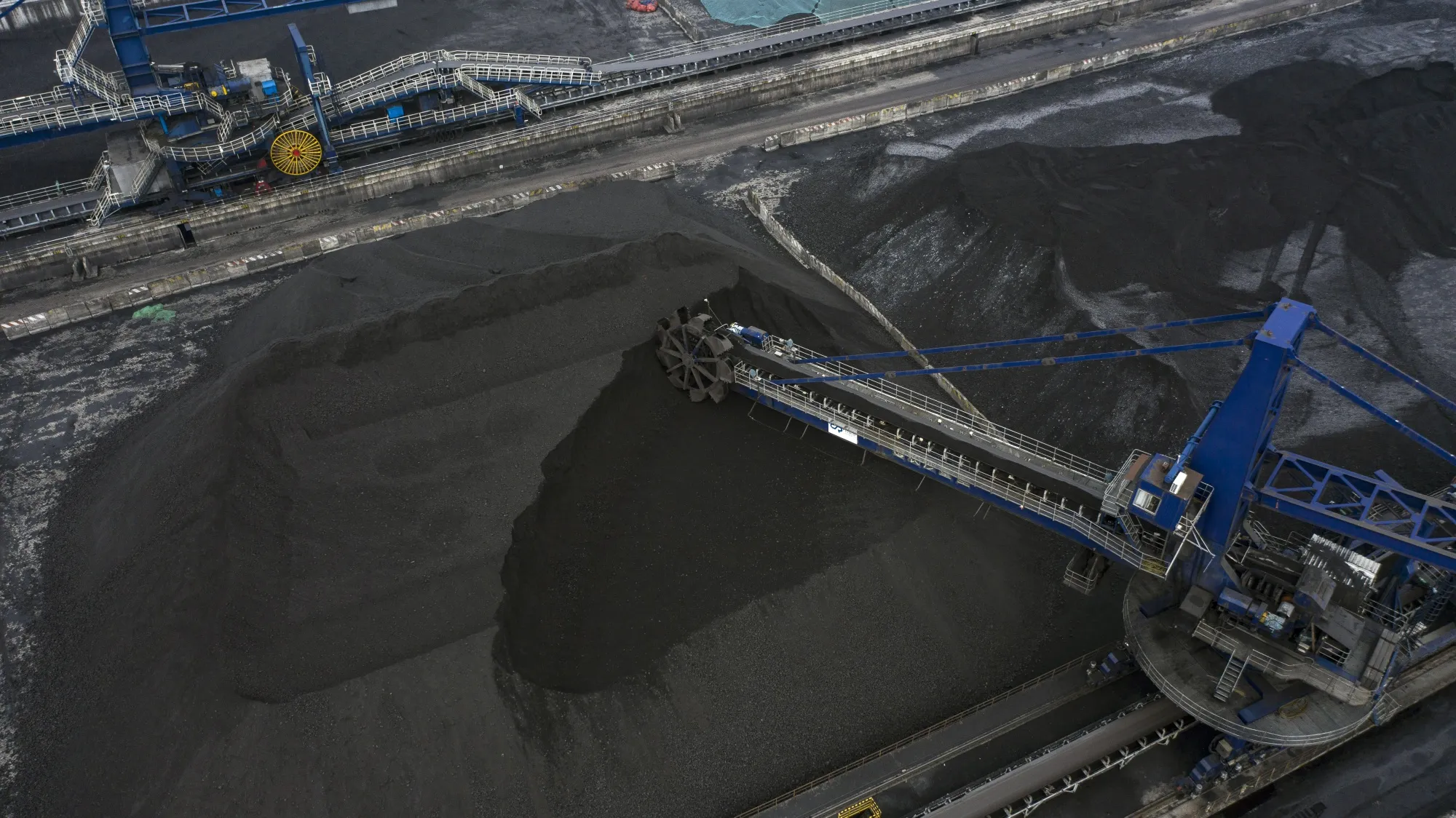 A stacker-reclaimer operates at a coal stockpile site in Taicang, Jiangsu Province, China, on&nbsp;Oct. 23.&nbsp;