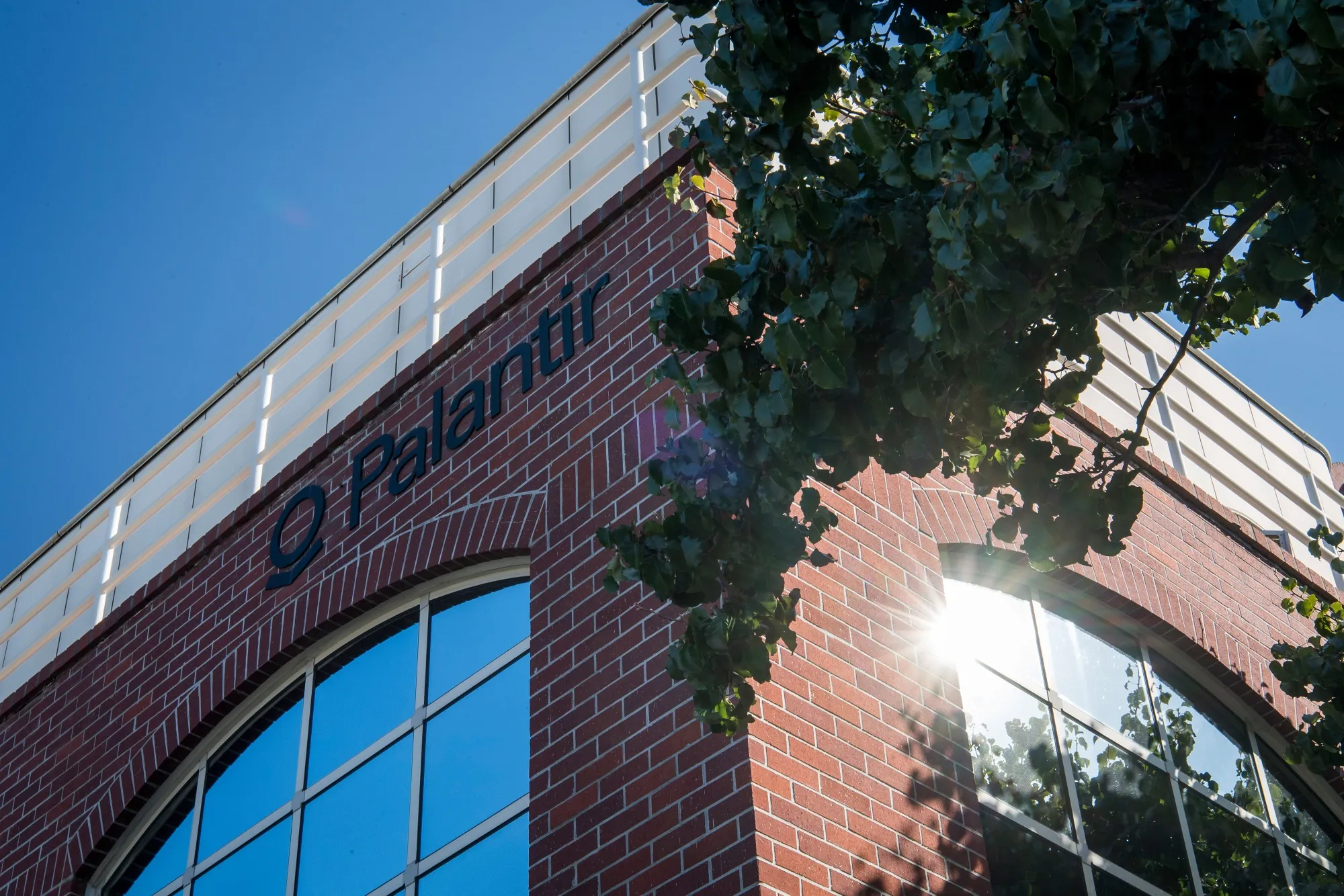 Palantir Technologies Inc. signage is displayed outside the company's headquarters in Palo Alto, California, U.S.