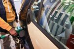 A customer refuels a vehicle at a gas station operated by PKN Orlen n Warsaw.