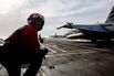 An F/A-18E Super Hornet fighter jet prepares to launch from the USS Abraham Lincoln  aircraft carrier on April 15.