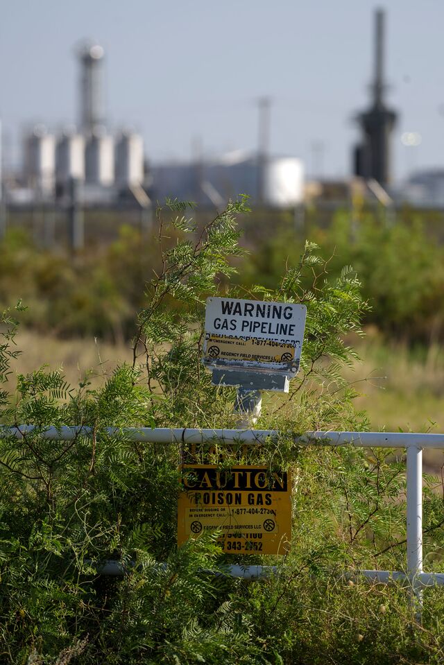 Warning signs in front of a processing plant outside Pecos, Texas.