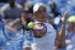 Ashleigh Barty, of Australia, returns a shot to Jil Teichmann, of Switzerland, in the women's single final of the Western & Southern Open tennis tournament, Sunday, Aug. 22, 2021, in Mason, Ohio. Top-ranked Barty had a tough opener to her 2022 season, having to rally from a set and a break down to beat 17-year-old American Coco Gauff 4-6, 7-5, 6-1 on Wednesday, Jan. 5, 2022, in the second round of the Adelaide International.(AP Photo/Darron Cummings, File)