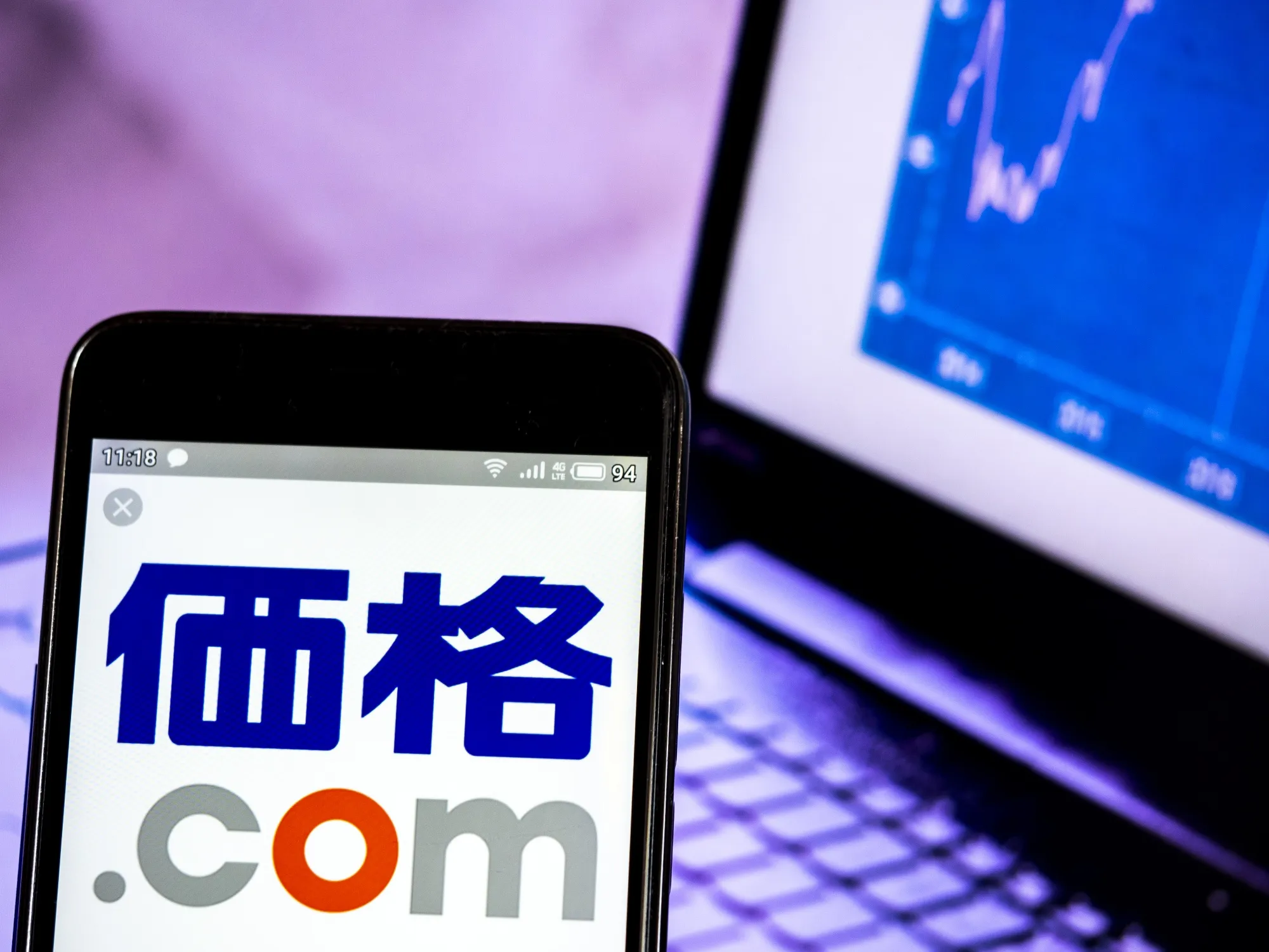 In this photo illustration a Kakaku.com, Inc, logo seen