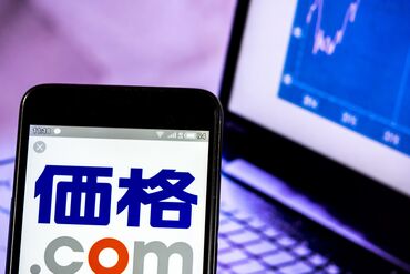 In this photo illustration a Kakaku.com, Inc, logo seen