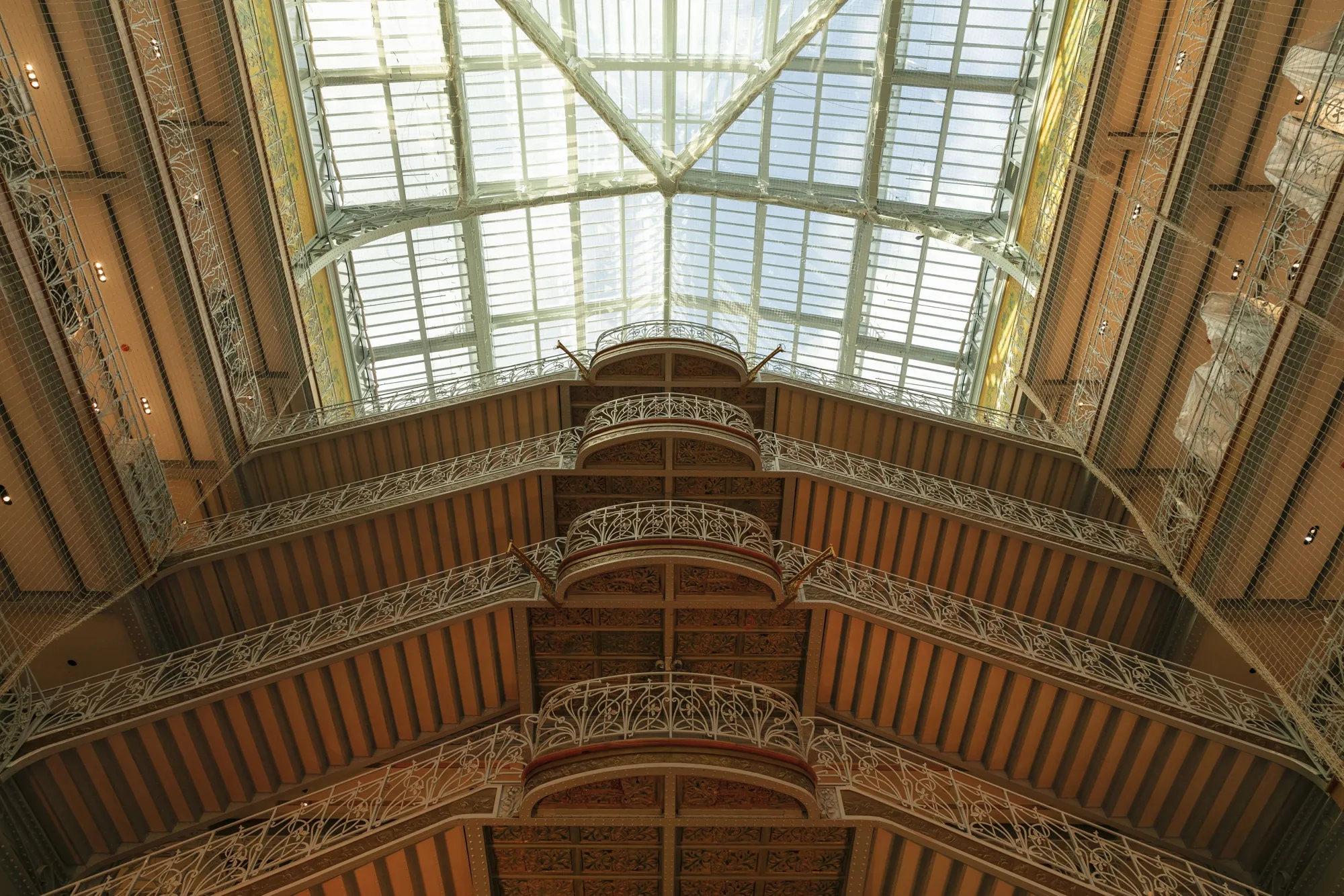 Wrought-iron balconies and banisters&nbsp;on La&nbsp;Samaritaine’s grand staircase.