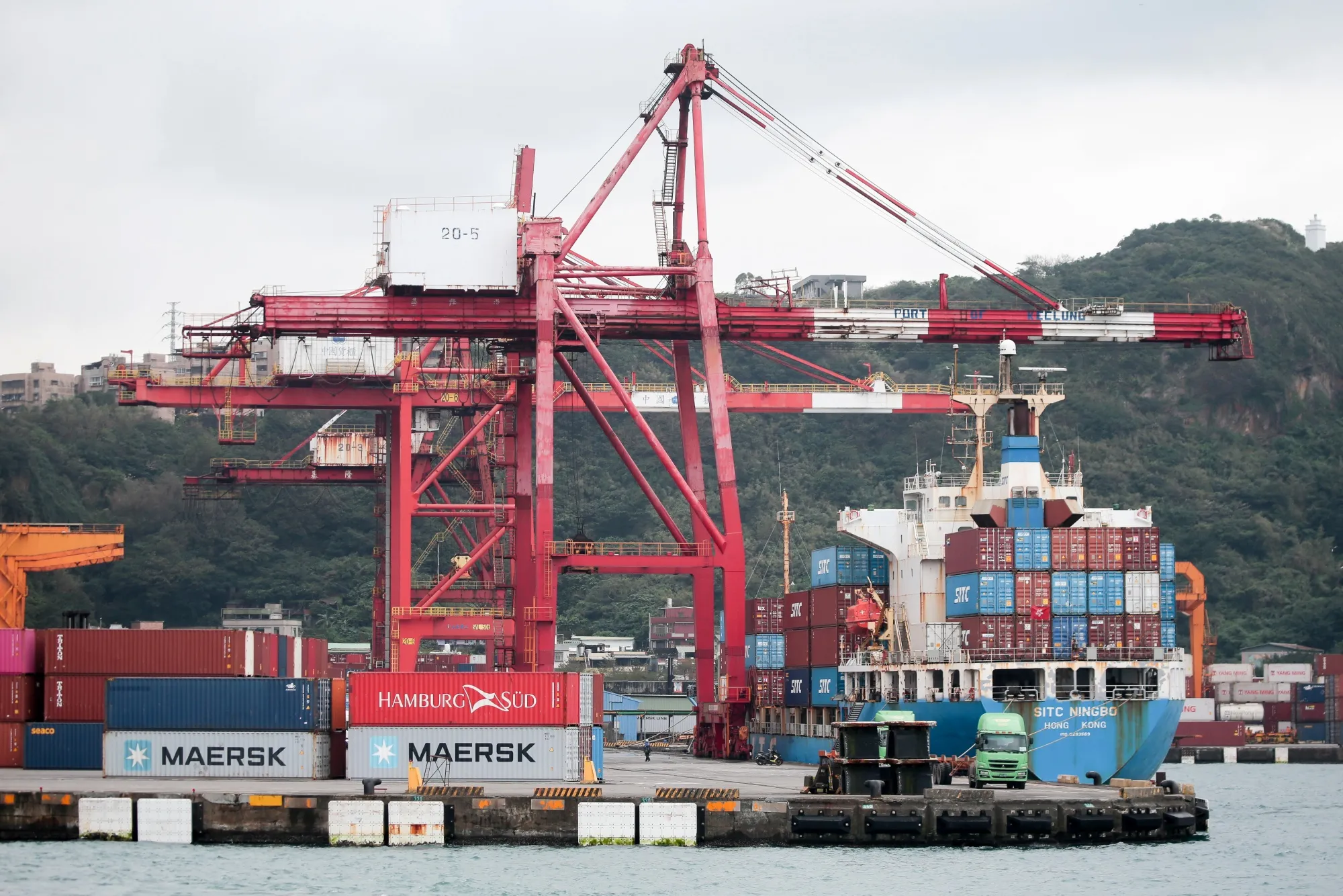 Gantry cranes and a container ship at the Port of Keelung in Keelung, Taiwan.