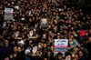 Protesters hold up an image of Qassem Soleimani, an Iranian commander, during a demonstration following the U.S. airstrike in Iraq which killed him, in Tehran, Iran,.