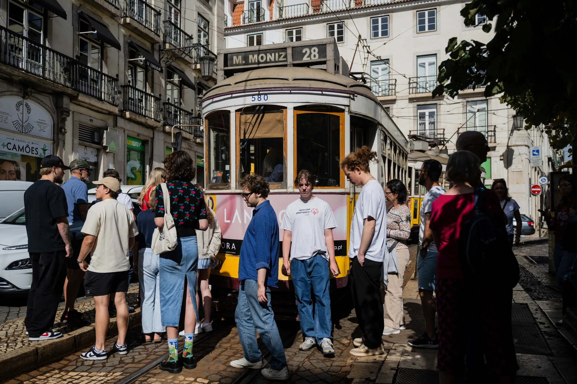 Pedestrians at Camoes square in Lisbon.