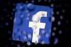 The Facebook Inc. logo is displayed an Apple Inc. iPad Air past water droplets in this arranged photograph in Washington, D.C., U.S., on Monday, Jan. 27, 2014. Facebook Inc. is expected to release earnings data on Jan. 29.