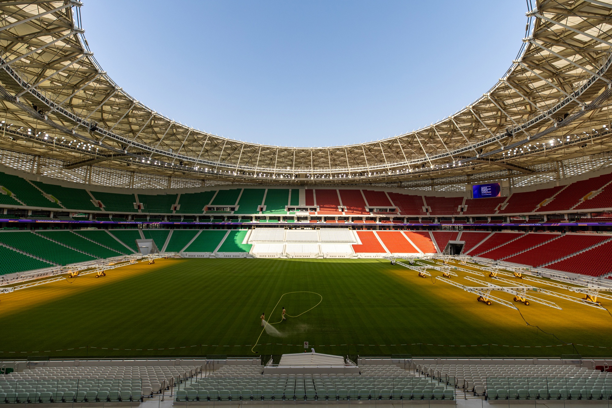 Grounds crew water the grass pitch surface of the Al Thumama football stadium in Doha, Qatar, on Monday, June 20, 2022. The stadium will be a venue for the upcoming 2022 FIFA World Cup in Qatar.