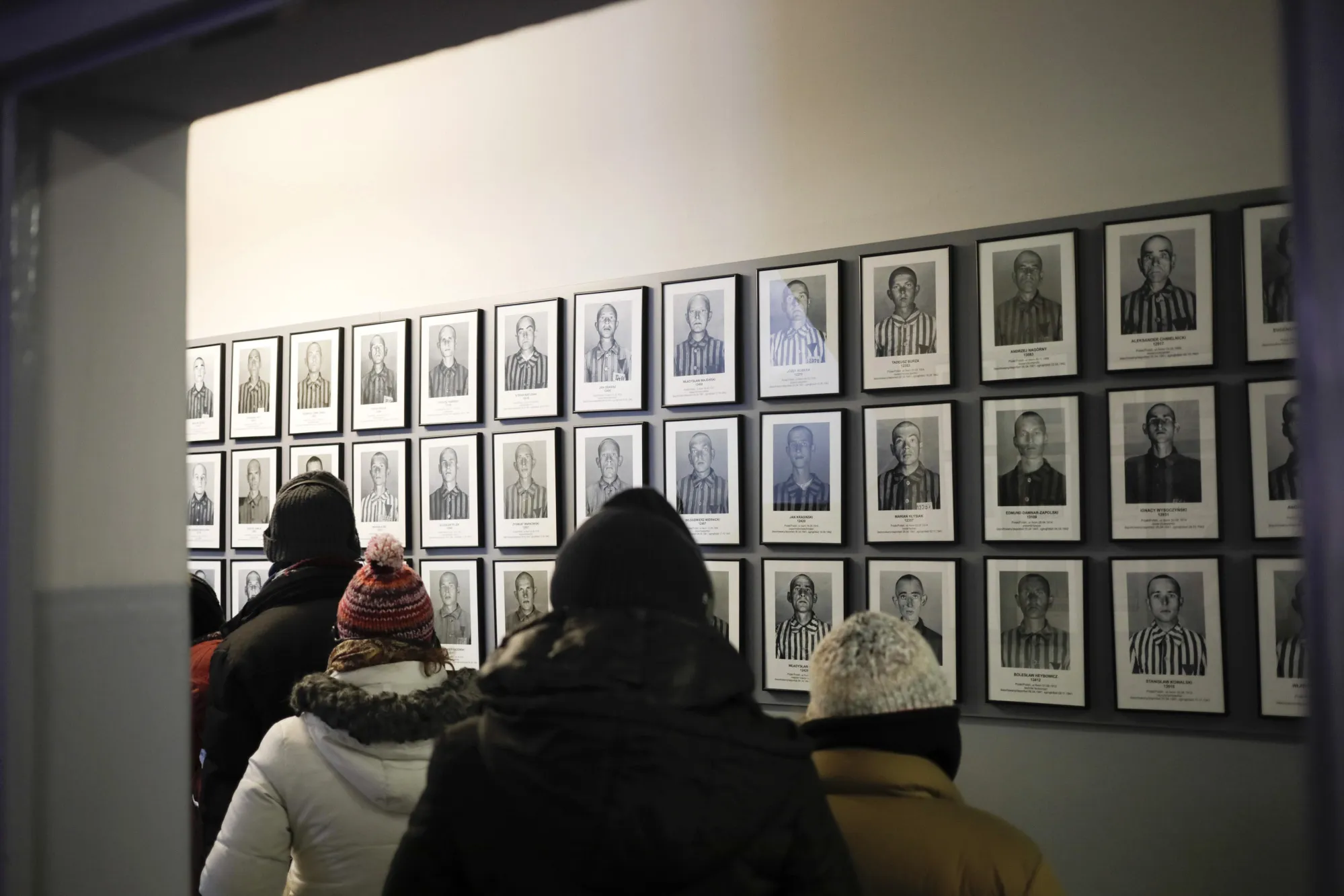 Photographs of holocaust victims at the Auscwitz-Birkenau concentration camp museum in Poland.