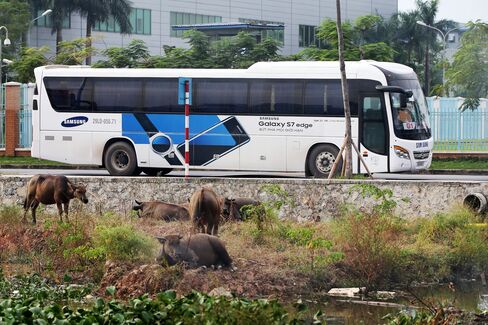 A company bus arriving at the plant.
