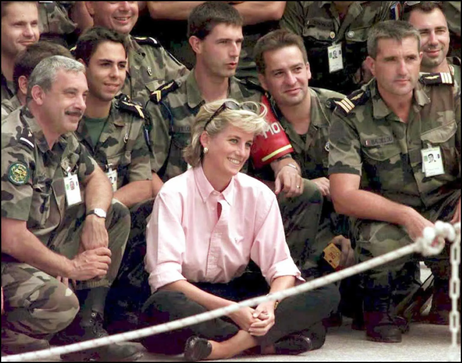 Diana, Princess of Wales, poses for a photograph with French SFOR soldiers at Sarajevo airport on Aug. 10, 1997.
