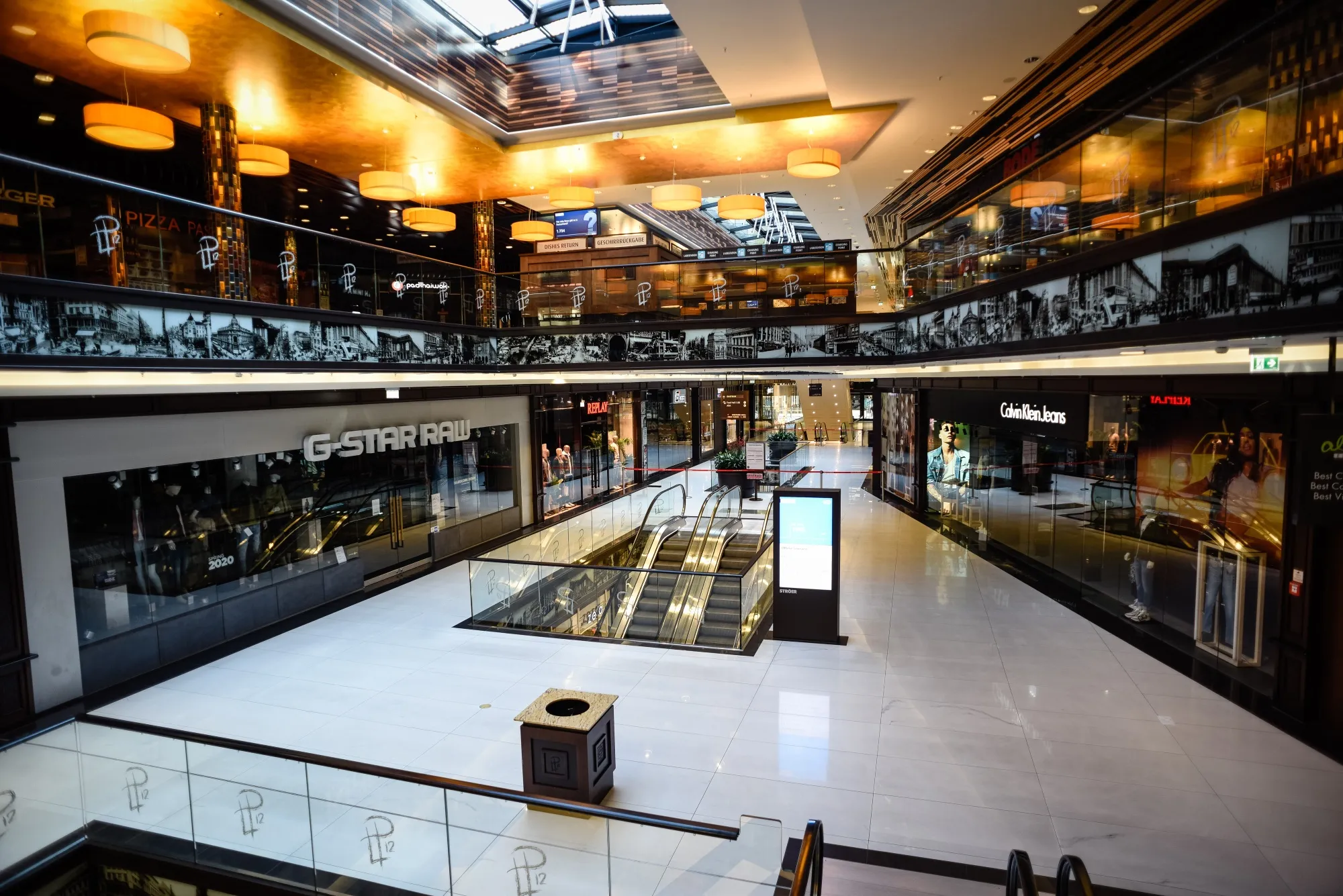 Walkways and floor space stand deserted outside closed stores at&nbsp;a mall in Berlin on March 26.
