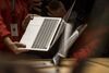 Attendees view the new MacBook Pro laptop