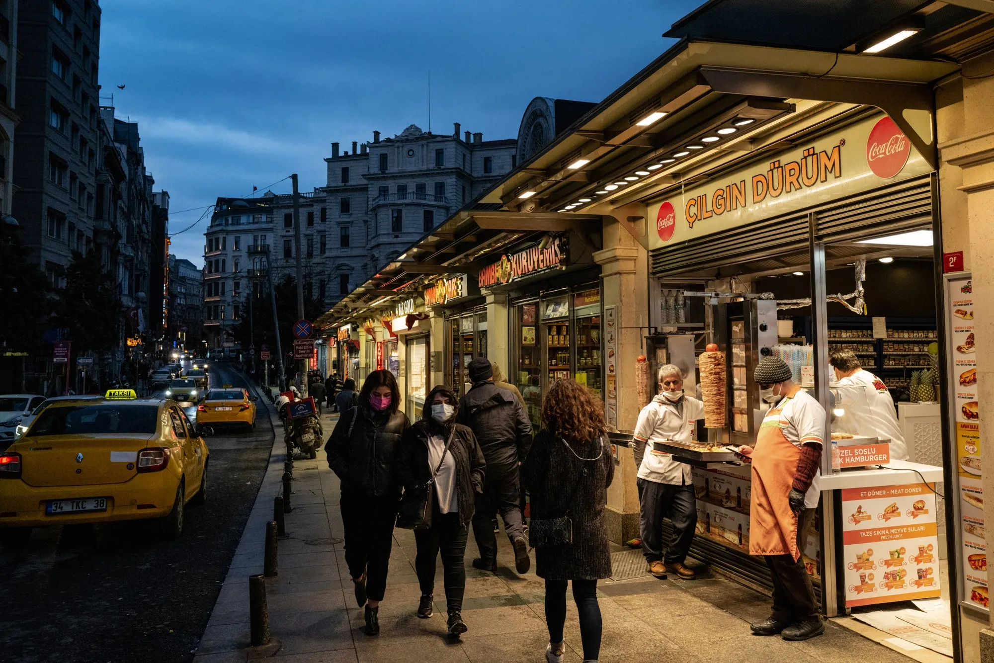 Fast food restaurants line a street leading out of Taksim Square in Istanbul, Turkey.