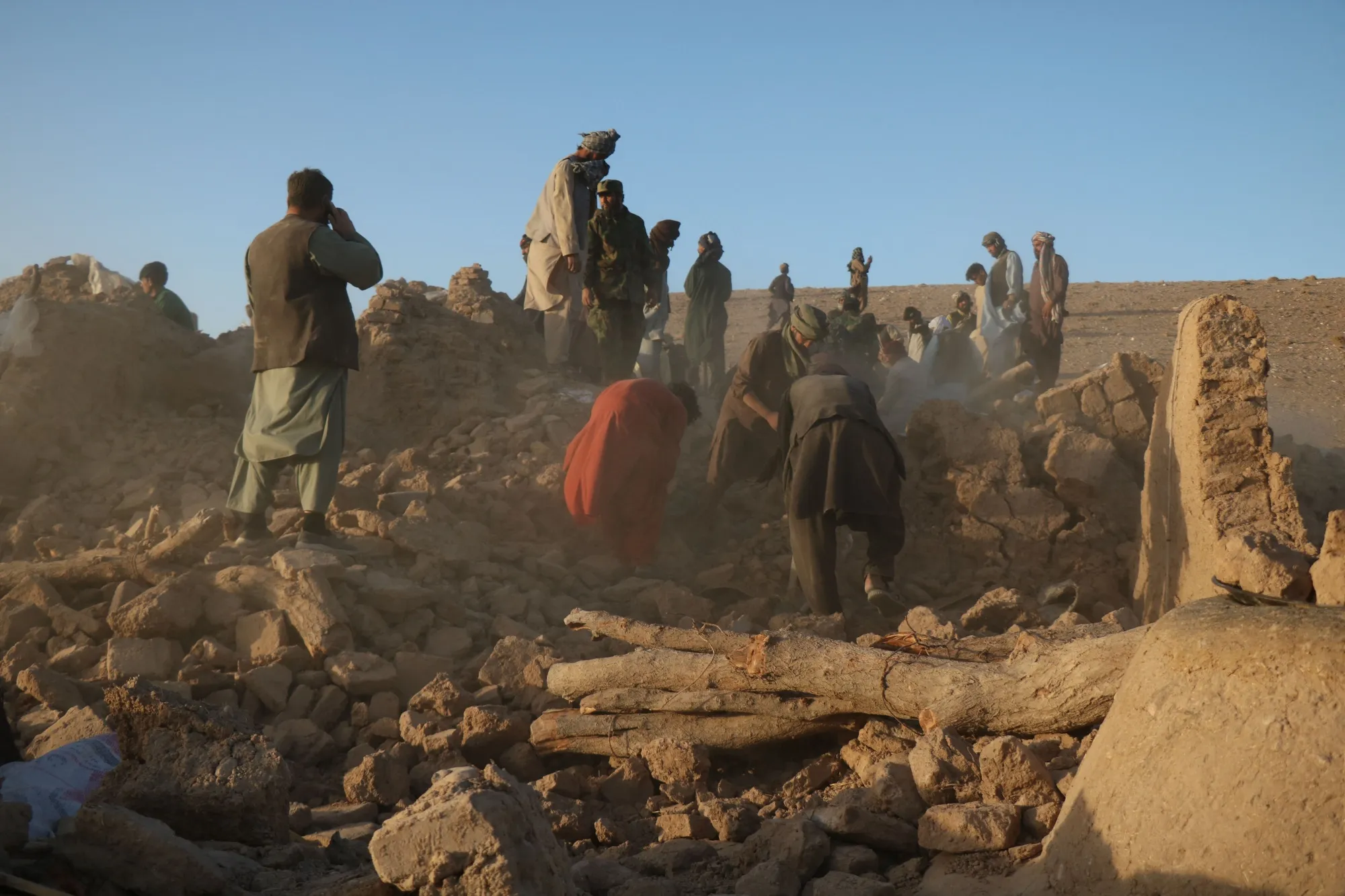 Afghan residents clear debris in Sarbuland village, Herat province on Oct.&nbsp;7.