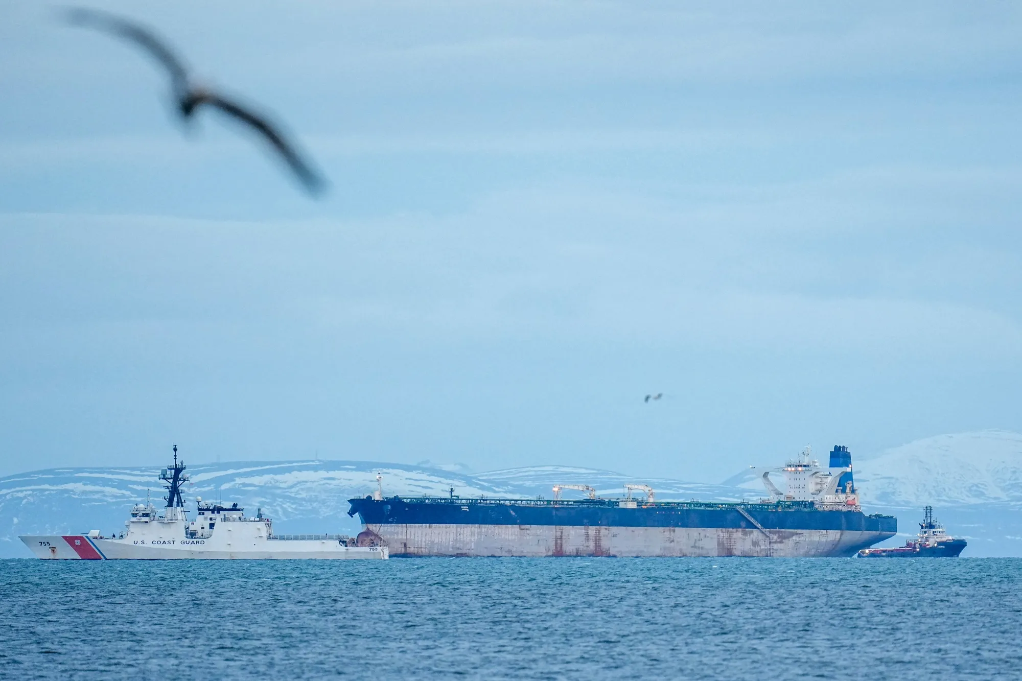 A US Coast Guard ship accompanies the Marinera oil tanker&nbsp;in Burghead, Scotland, on Jan. 14.