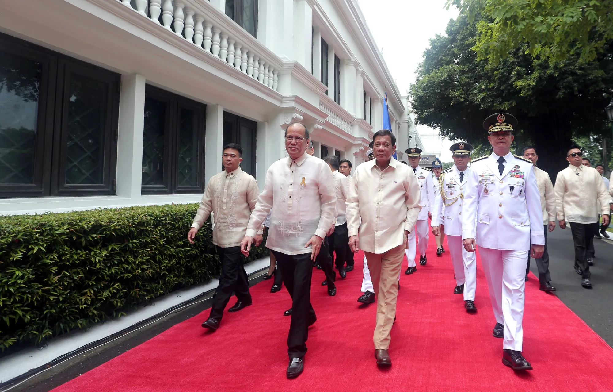 Aquino, second left, with Rodrigo Duterte, second right, at the Malacanan Palace Grounds in Manila in 2016.