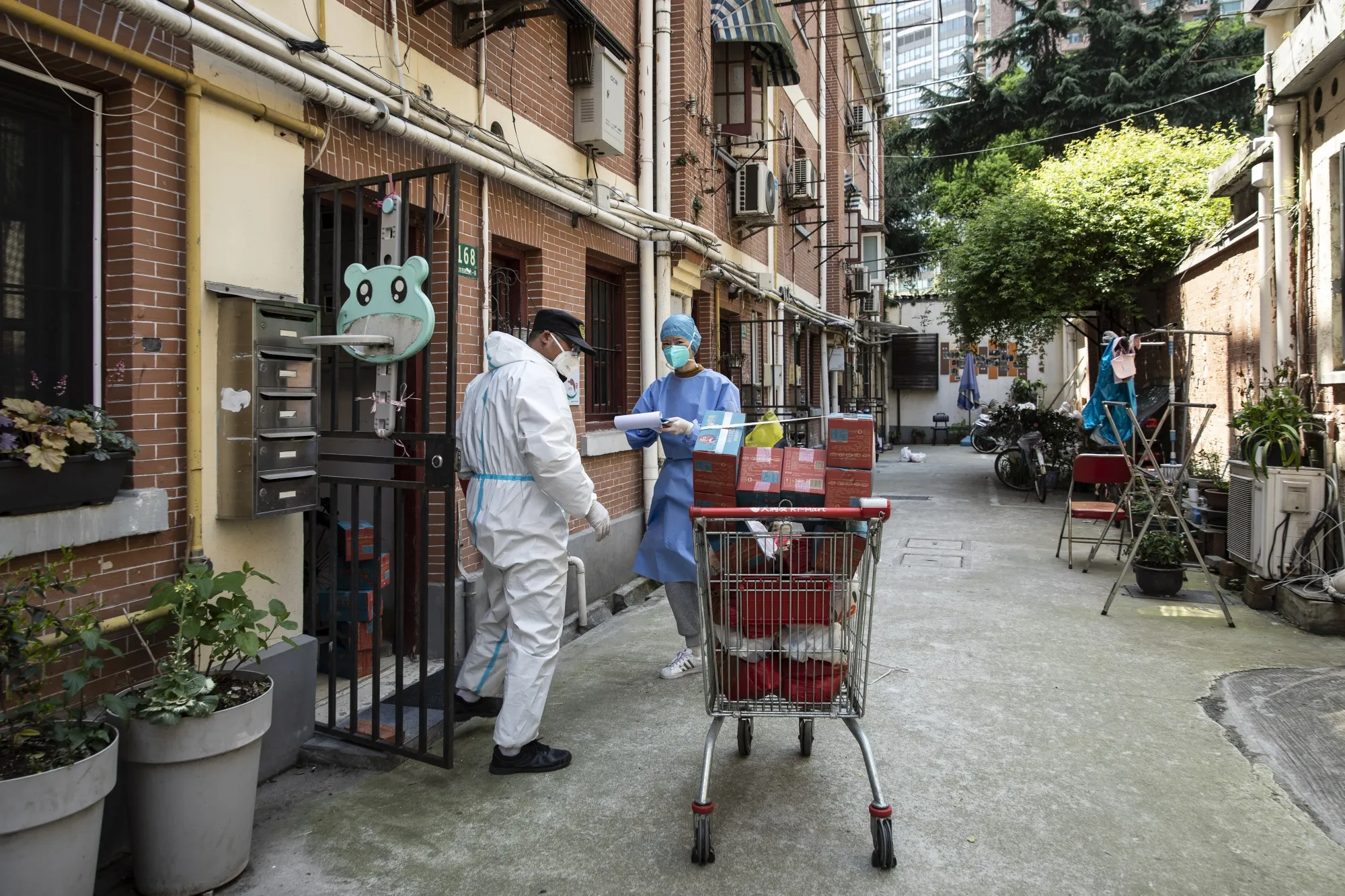 Volunteers transport food supplies delivered by the government in Shanghai, on April 9.