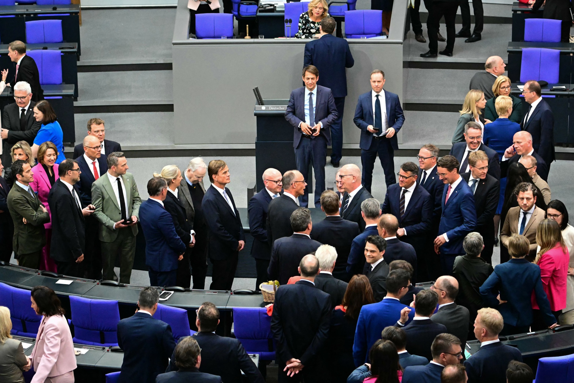 Lawmakers queue to congratulate Friedrich Merz on May 6.