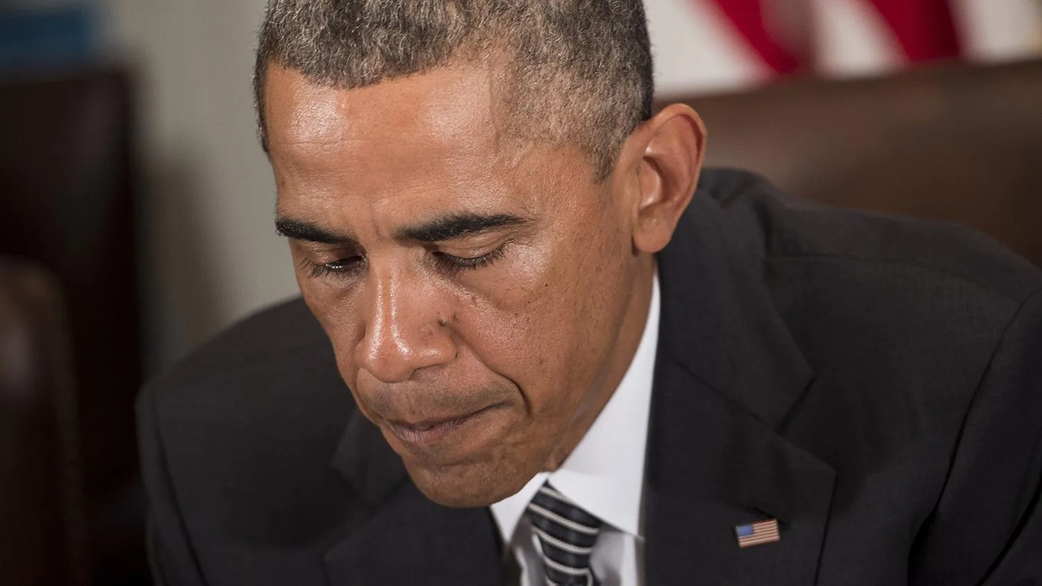 US President Barack Obama pauses while making a statement for the press after a meeting in the Cabinet Room of the White House October 15, 2014 in Washington, DC. Obama canceled campaign and fundraising travel for Democrats to attend the meeting on Ebola after a second case of the disease was contracted inside the United States.
