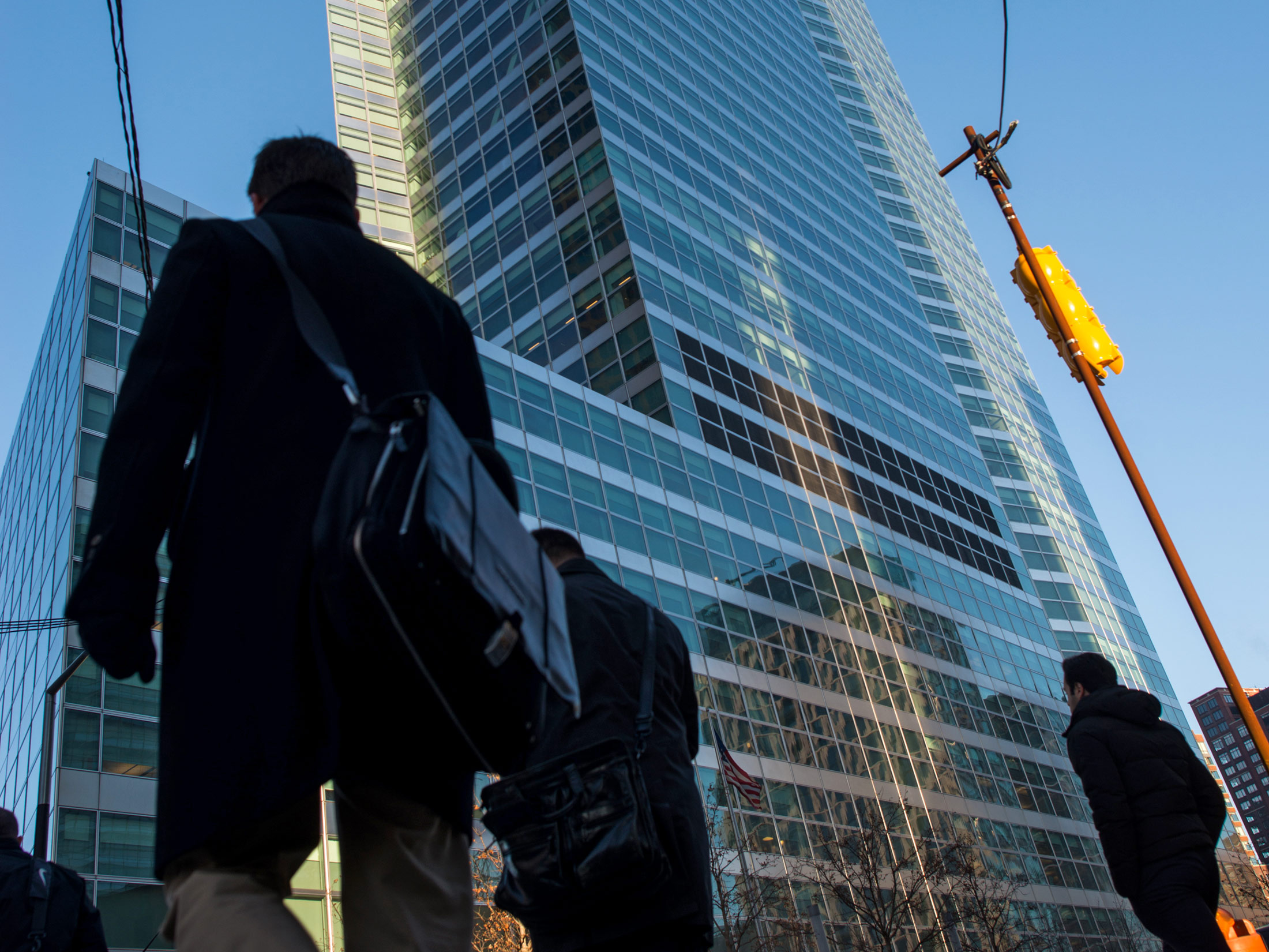 People walk past the Goldman Sachs headquarters in New York.
