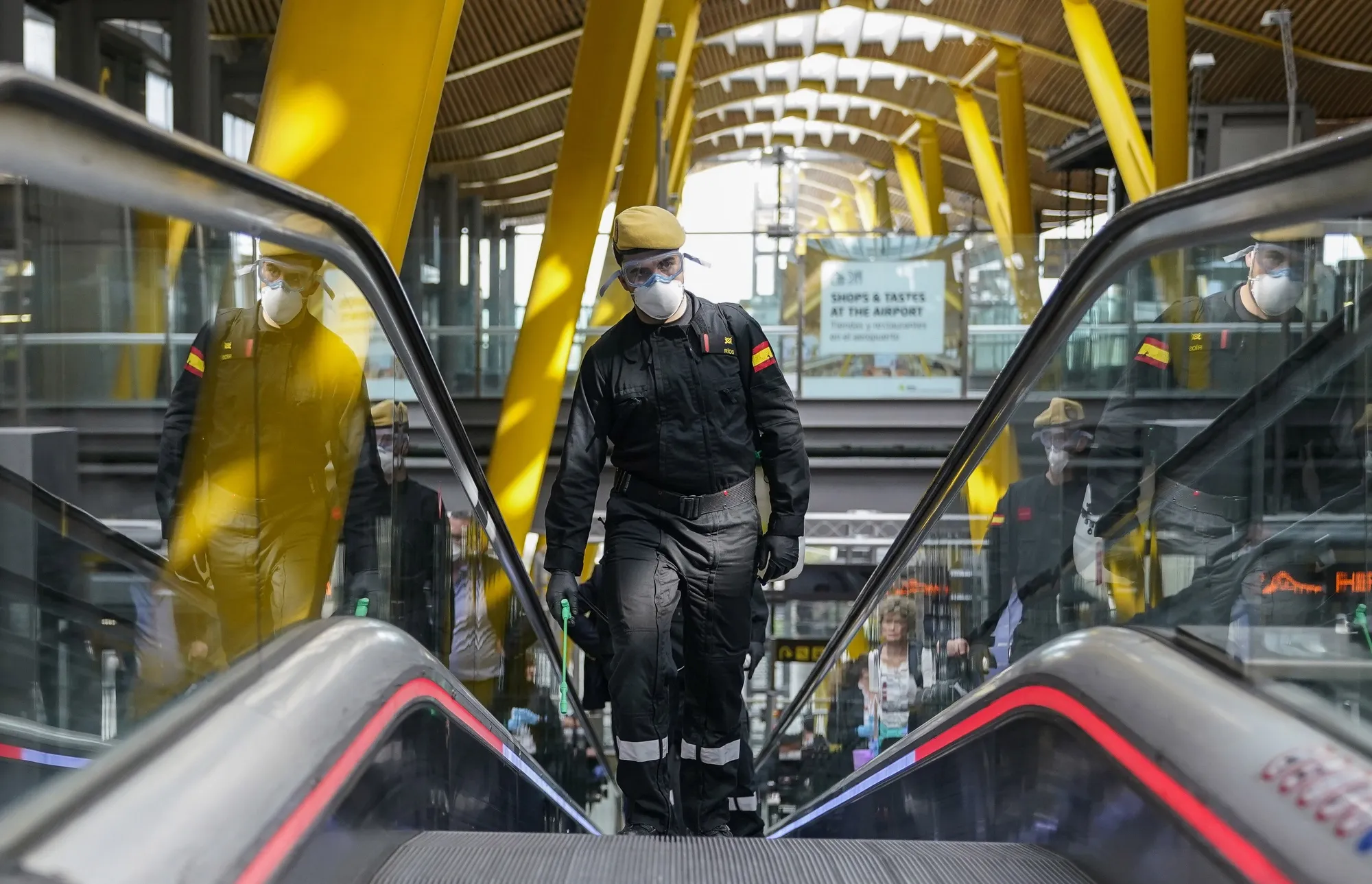 A member of Spain's military emergencies unit during&nbsp;a disinfecting operation at Madrid Barajas airport on March 19.