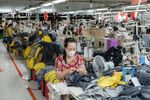 A worker cuts off excess thread from items of clothing at a Thai Son S.P. Co. garment factory in Binh Thuan province, Ho Chi Minh City, Vietnam, on Thursday, Apr. 10, 2025. For more than 70 years, many emerging nations, especially in Asia, have become the low-cost manufacturer to the US, the world’s biggest consumer.