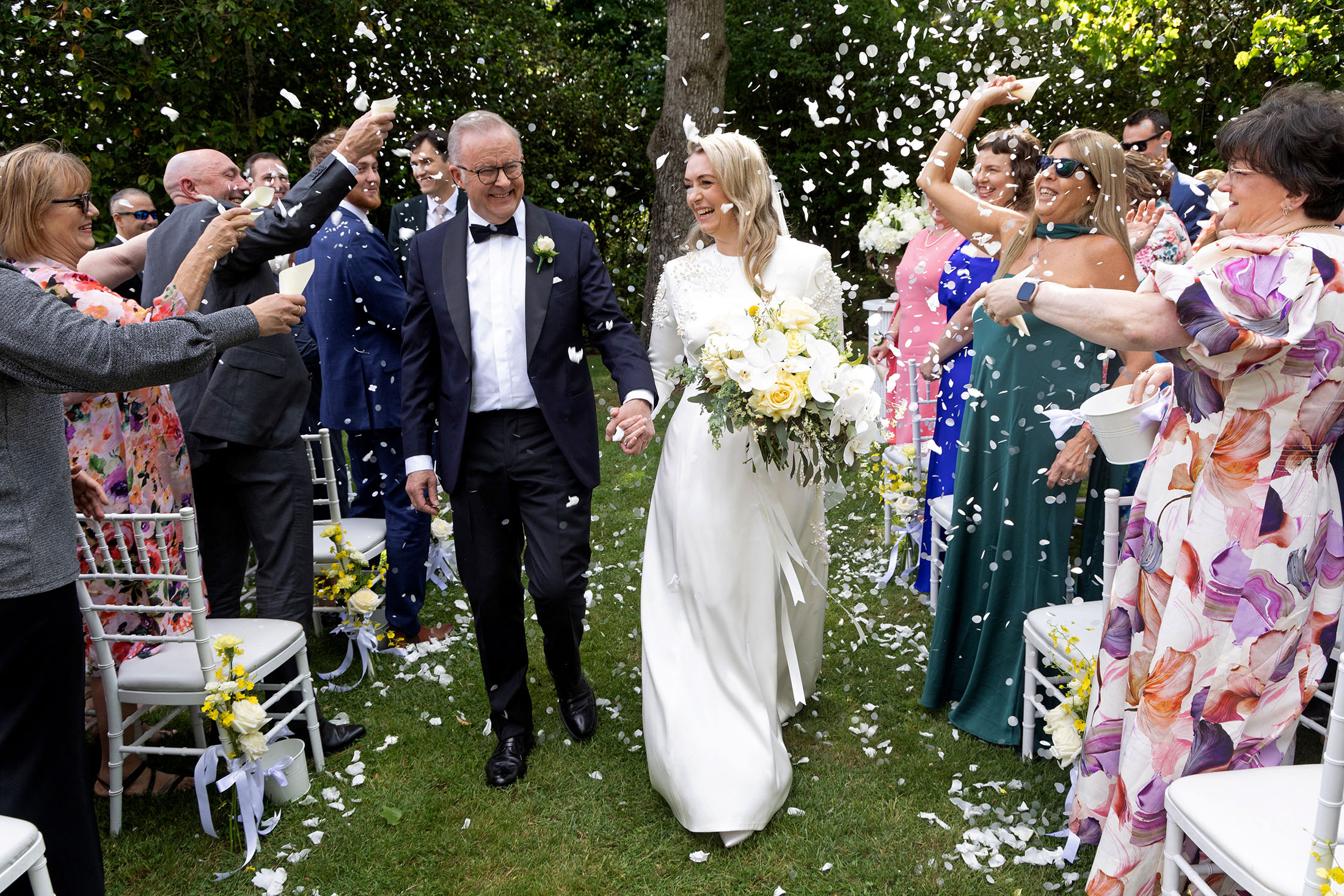 Anthony Albanese and his new wife Jodie Haydon walk together during their wedding ceremony in Canberra on Nov. 29.