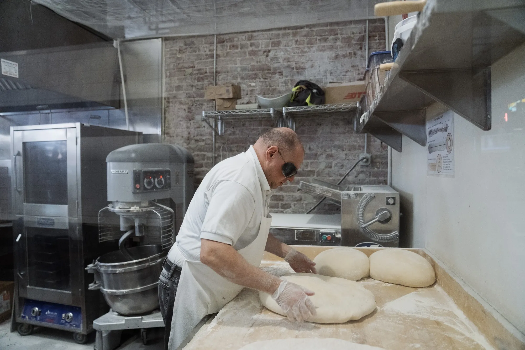 A worker at a restaurant at Grand Central Market in Los Angeles.&nbsp;