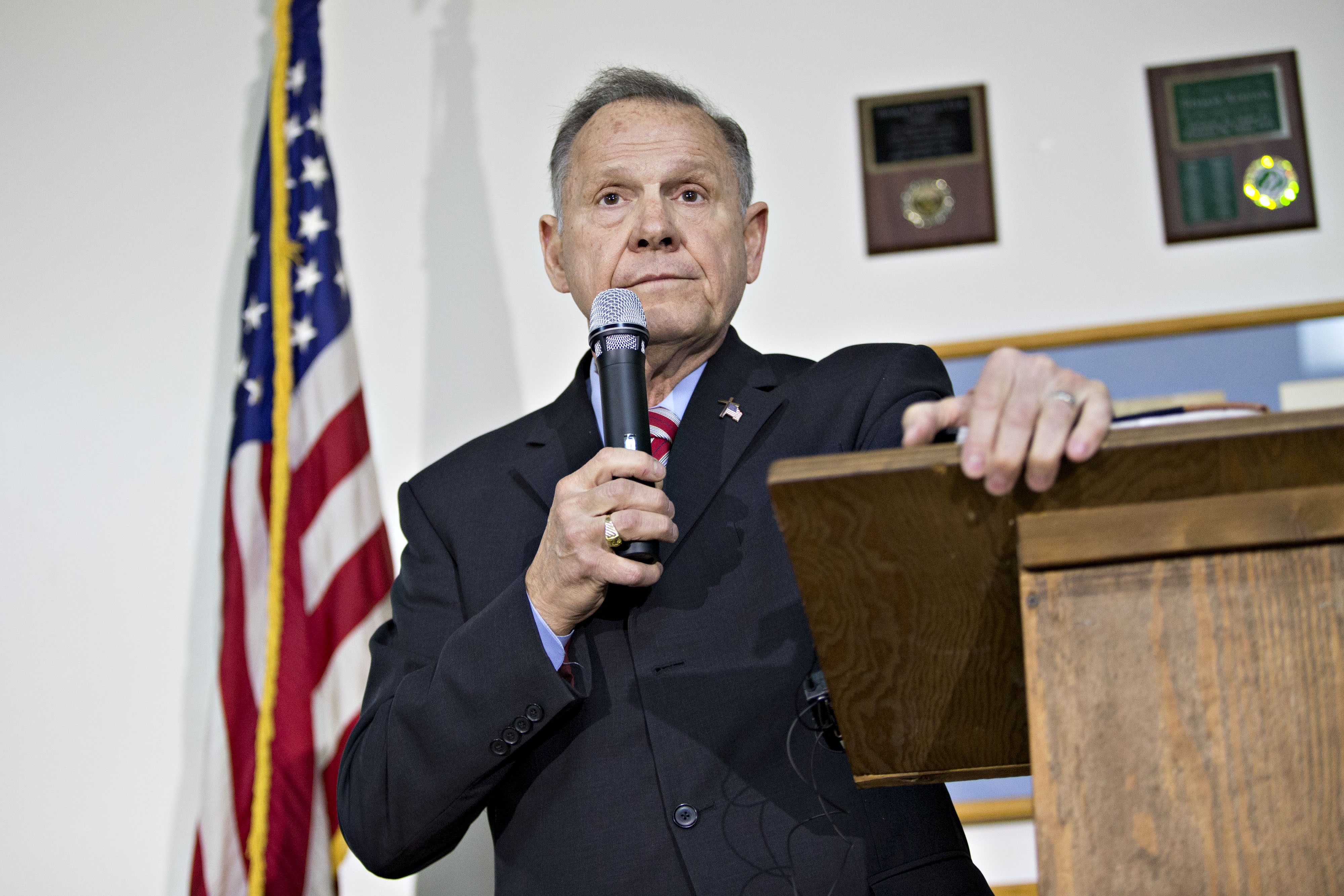 Moore pauses while speaking during a campaign rally in Henagar, Alabama, on Nov. 27.