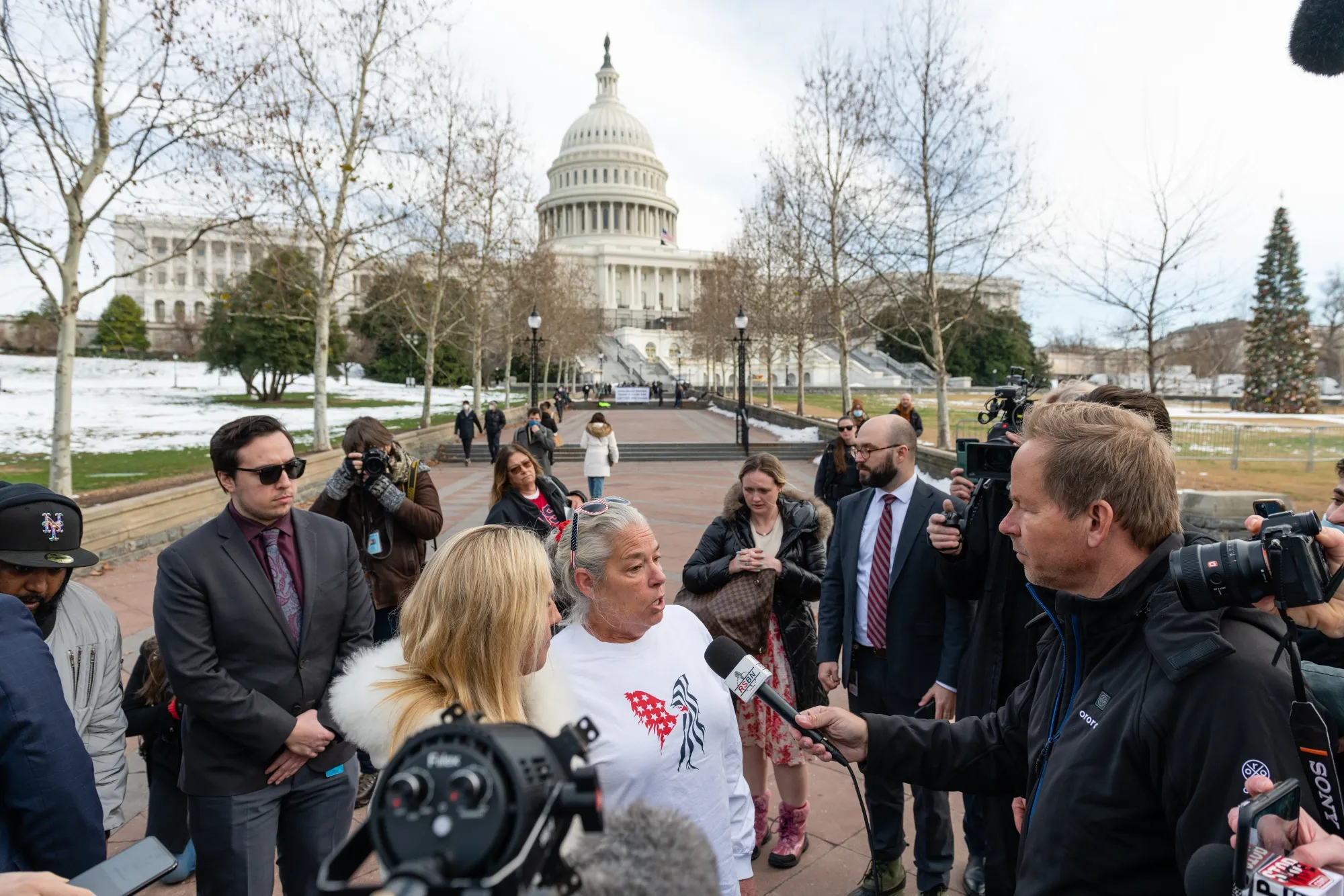 Representative Marjorie Taylor Greene, center left, and Micki Witthoeft, mother of Ashli Babbitt, on the first anniversary of the&nbsp;insurrection at the US&nbsp;Capitol in&nbsp;2022.
