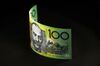 An Australian one hundred dollar banknote is arranged for a photograph in Sydney, Australia, on Wednesday, May 23, 2018. Australia's central bank chief Philip Lowe said last week that his nation and China together can be a force supportive of an open global trading system.