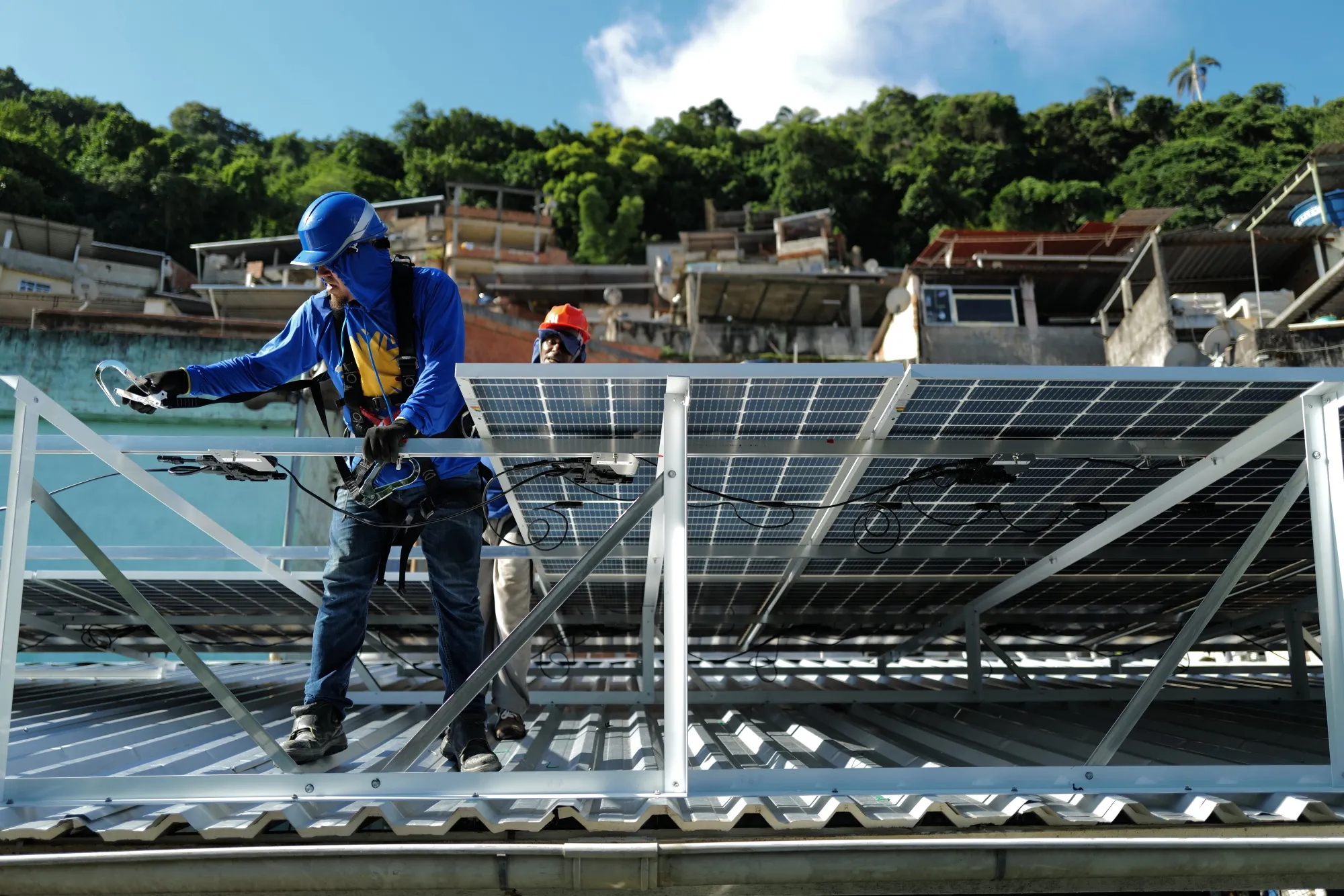 Workers&nbsp;install solar panels&nbsp;in Rio de Janeiro, Brazil.