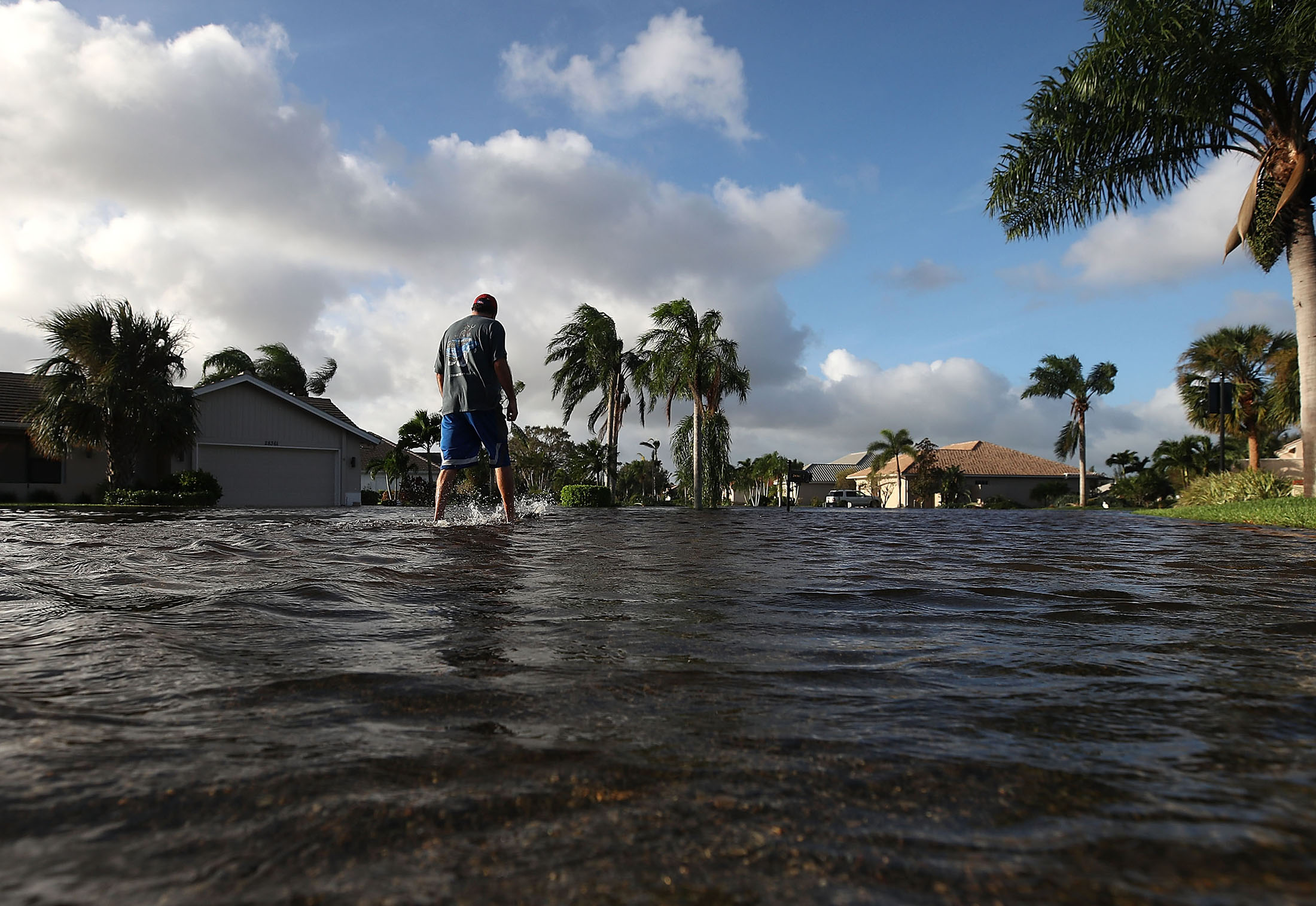 A man walks through Hurricane Irma floodwaters in Bonita Springs, Florida.
