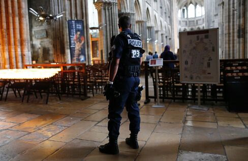Police stand guard at the Rouen Cathedral.
