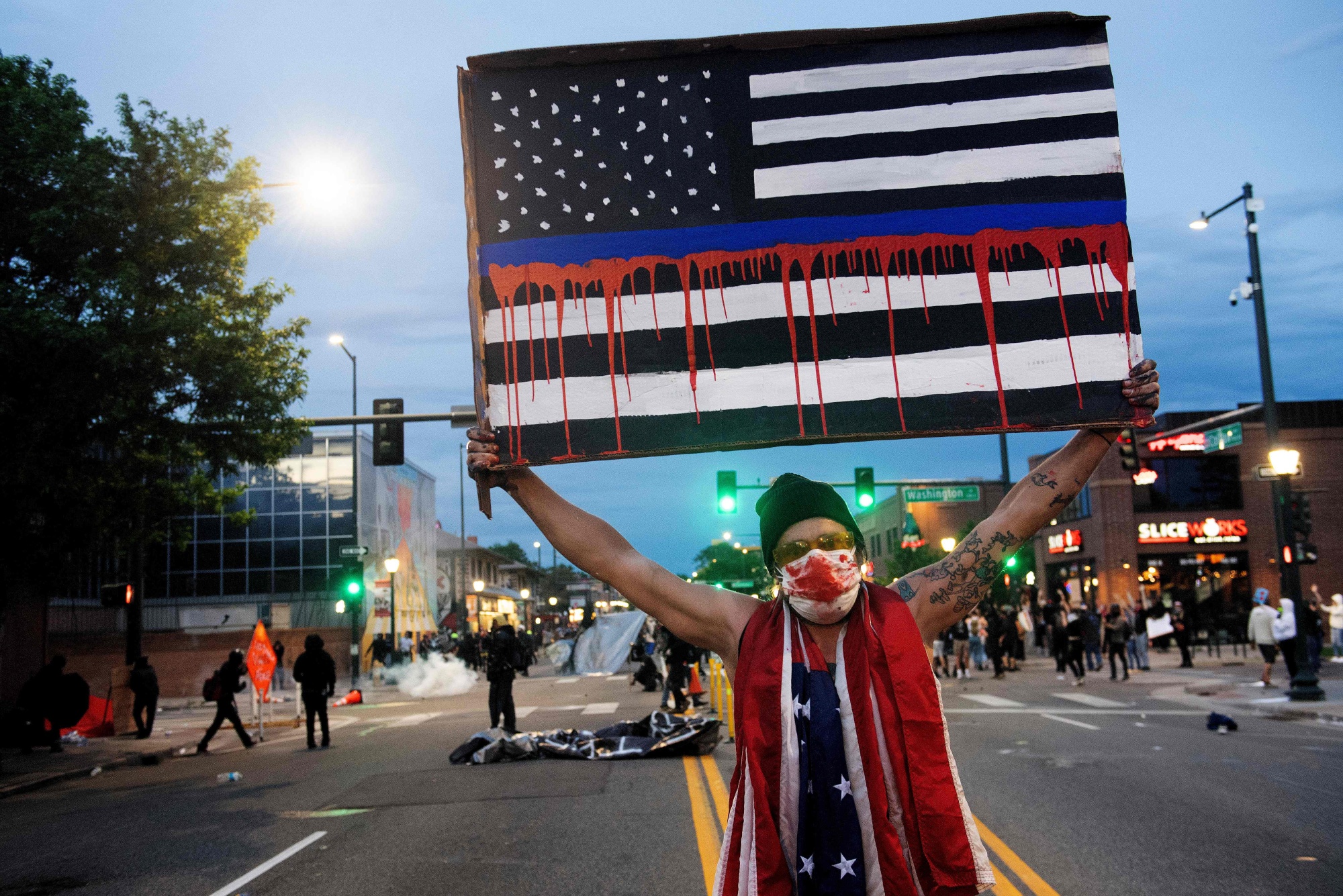A demonstrator holds up a sign during a protest in Denver, Colorado, on May 31.