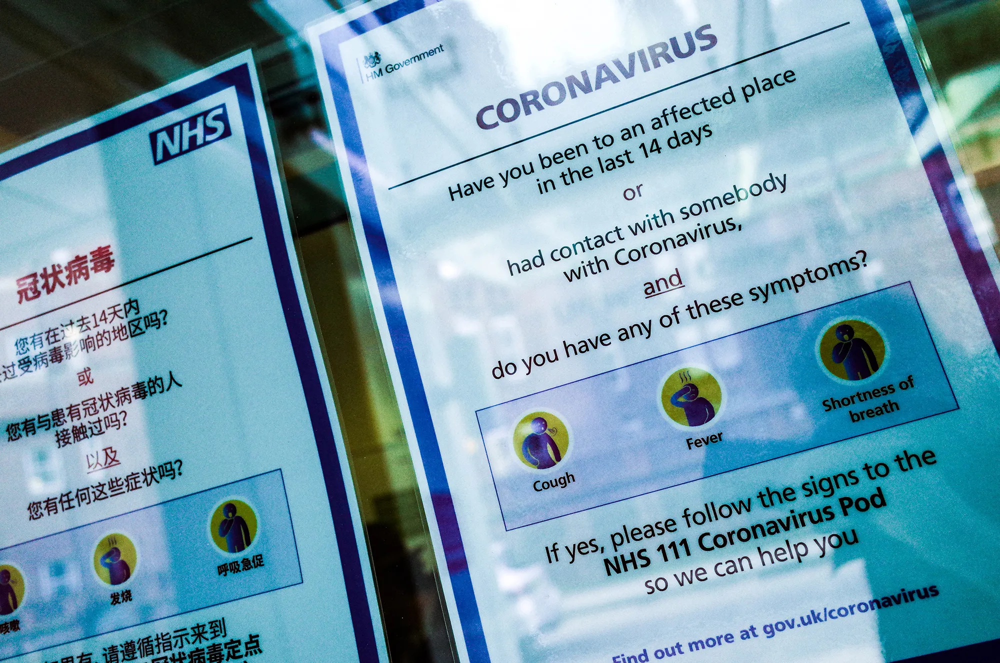 Signs offer advice regarding coronavirus&nbsp;at the entrance to University College Hospital, which houses a 'coronavirus pod' isolation unit, in London.