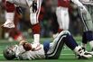 Quarterback Troy Aikman of the Dallas Cowboys lies