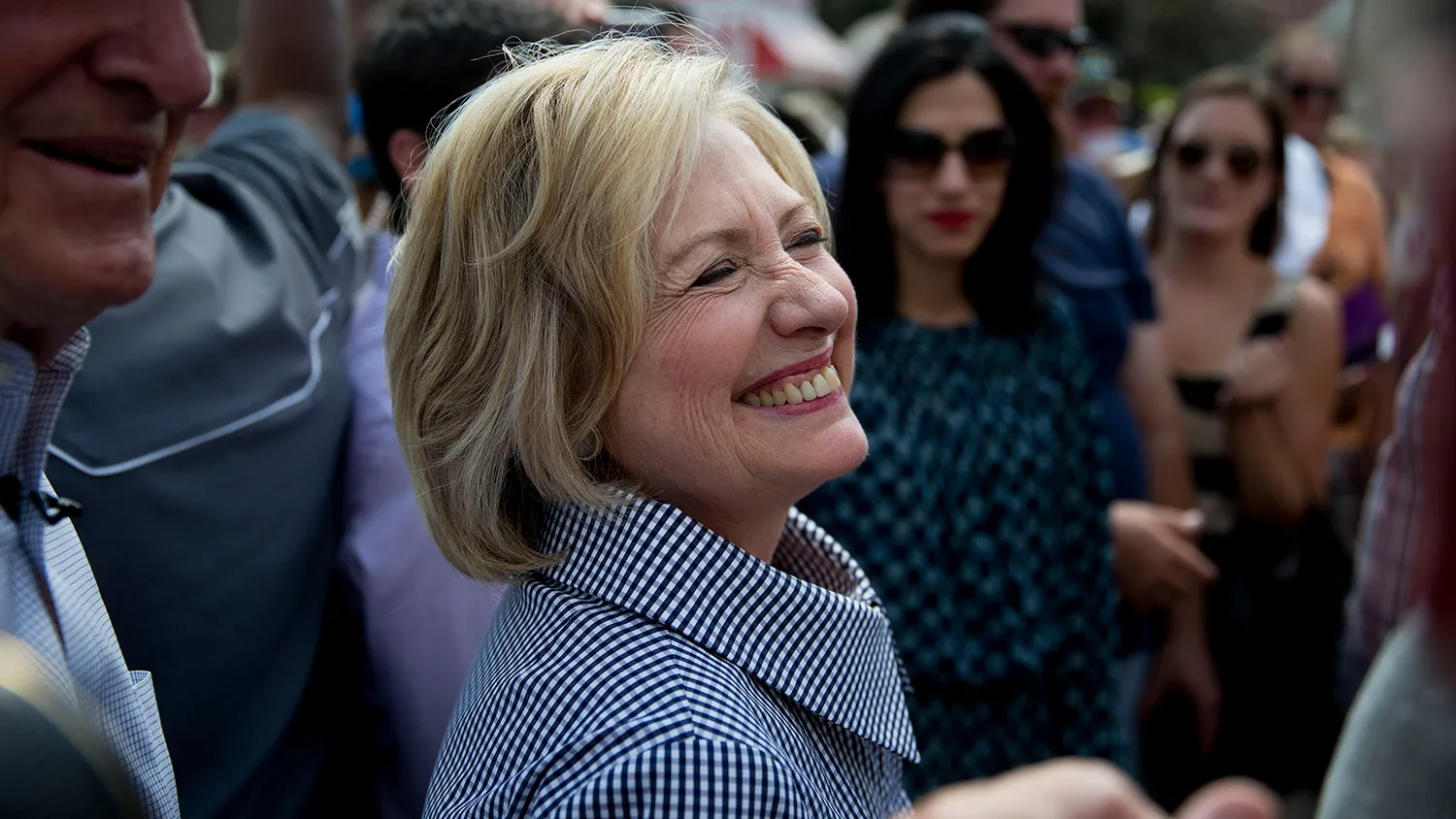 Hillary Clinton, former U.S. secretary of state and 2016 Democratic presidential candidate, smiles as she walks through the Iowa State Fair in Des Moines, Iowa, U.S., on Saturday, Aug. 15, 2015.

