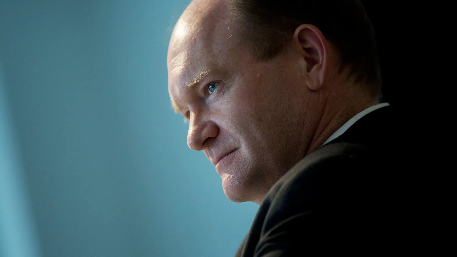 Senator Chris Coon, a Democrat from Delaware, listens to a question during an interview in Washington, D.C., U.S., on Thursday, June 18, 2015.
